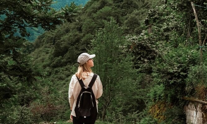 Travel.,Girl,Travels,Through,The,Mountains,And,Waterfalls,Of,Wild